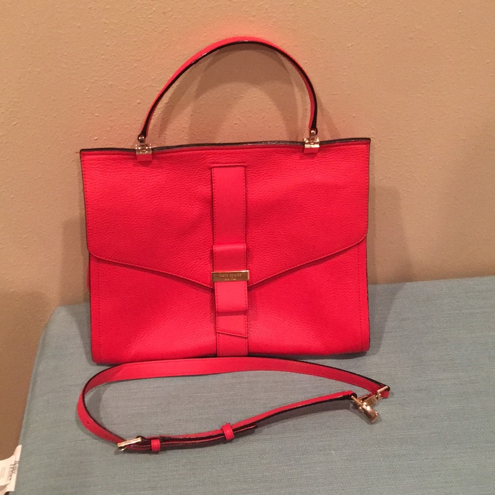 Red Kate Spade purse with short and long strap